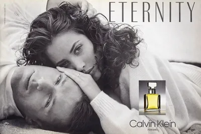 A black-and-white print advertisement for Calvin Klein's Eternity perfume, showing a woman with curly dark hair resting her face against a man with light hair who is lying down; a small color inset photo shows the yellow glass perfume bottle. The word "ETERNITY" appears at the top and "Calvin Klein Perfume" at the bottom right.