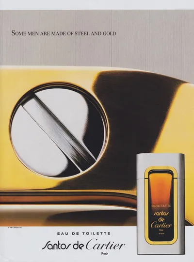 A vintage print advertisement for Santos de Cartier Eau de Toilette, featuring a close-up photograph of a gold and steel luxury lighter alongside the perfume bottle, which has a rectangular brushed-steel and gold design with an amber-colored liquid visible inside.
