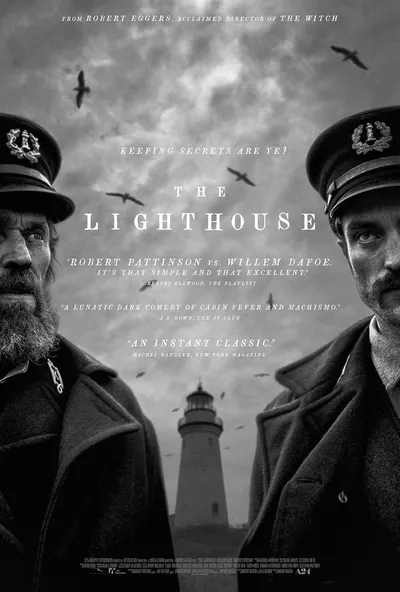 This is a black-and-white movie poster for "The Lighthouse," directed by Robert Eggers. It features two men in dark maritime captain's uniforms and caps facing each other, with a lighthouse and stormy sky visible in the background between them.